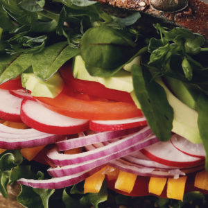 Fresh healthy food including lettuce, tomato, radish, onion